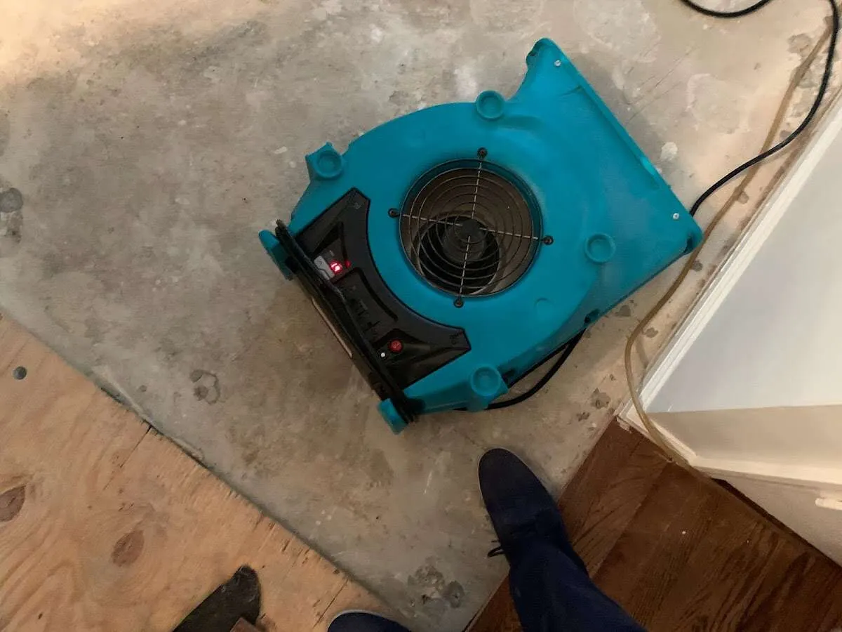 Air mover drying subfloor during Leak Detection & Repair in Elmsford